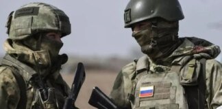 Simulating control over the city: occupiers in Kupyansk wave Russian flags