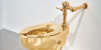 The artist behind the viral $6.2 million duct-taped banana also made a gold toilet — and it just sold for $12.1 million