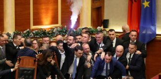 Albanian Parliament turns into a battlefield: flares, bottles, and accusations of falsification