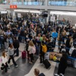 Hundreds of flights were canceled after a snowstorm struck on one of the busiest travel weekends of the year