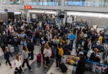 Hundreds of flights were canceled after a snowstorm struck on one of the busiest travel weekends of the year