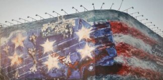 A mural warning of retaliation in case of a US military strike appeared in Tehran's central square