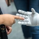 Who should be responsible for putting AGI into humanoid robots?